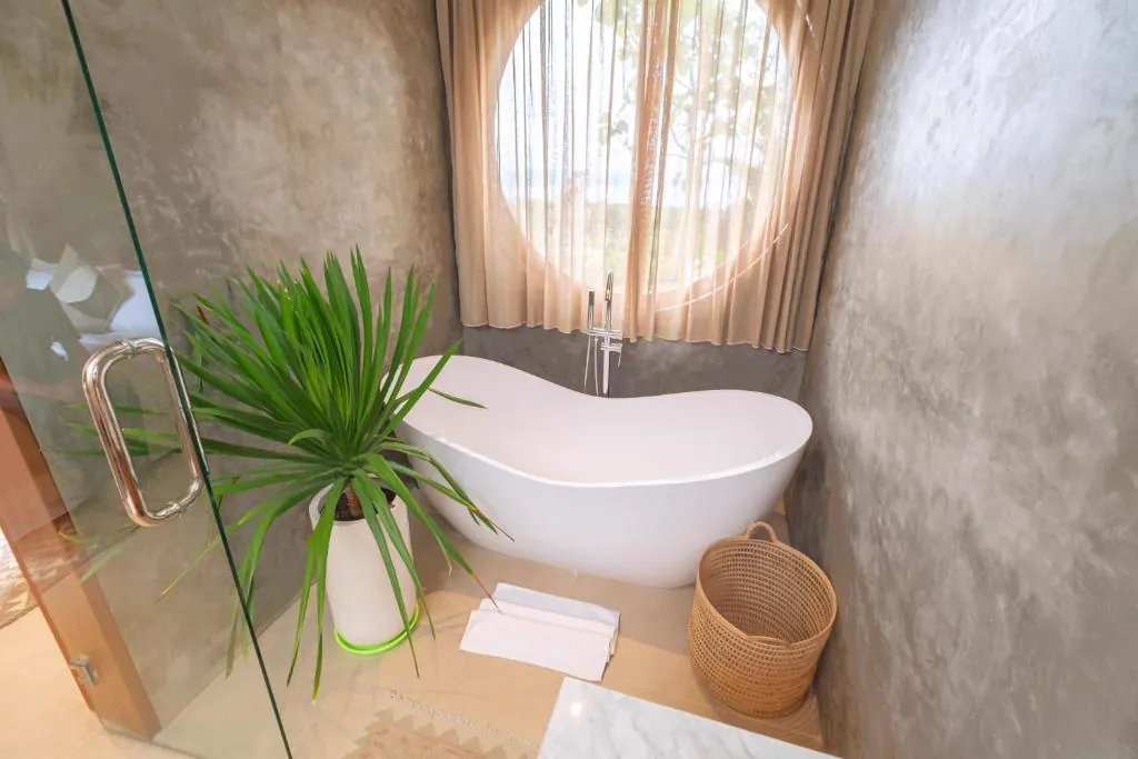 Freestanding bathtub by a round window