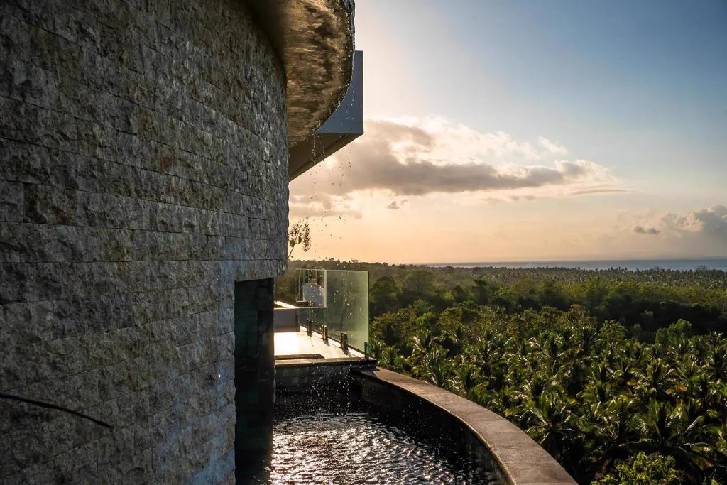 Water feature and view over the jungle to the sea
