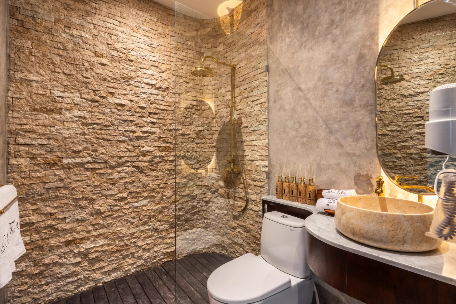 Stone bathroom with rain shower
