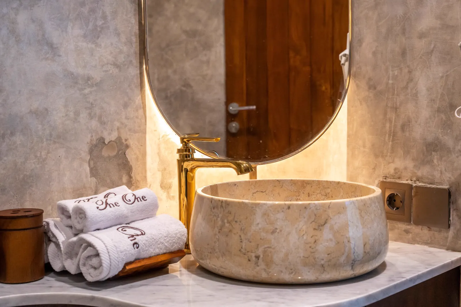 Marble basin and gold tap